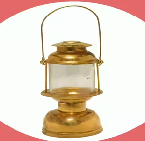 Polished <b>brass</b> mini hurricane oil <b>lantern</b> with curved wire handle, available at wholesale prices. - Product Image 1