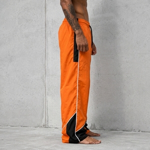 Pantalon de survêtement coupe-vent pour homme, bas de tenue haute performance conçu avec un matériau léger et à séchage rapide pour l'exercice et la course à pied - Product Image 3
