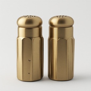 Juego de salero y pimentero decorativos de alta calidad diseñado para cocinas modernas que ofrece una apariencia elegante y comodidad diaria. - Product Image 1