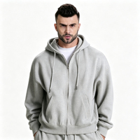 Ensemble de survêtement décontracté haut de gamme gris clair moderne, respirant, avec sweat à capuche zippé et pantalon large à cordon de serrage, deux pièces