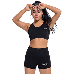 Ensemble de yoga 2 pièces noir pour femme, short taille haute et crop top dos nageur à encolure dégagée, en Spandex et Polyester uni, sans couture, extensible dans les quatre sens - Product Image 1
