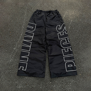 Custom Unisex Lightweight Nylon Track Pants Side Embroidery Logo Casual Streetwear Windbreaker Baggy Jogger Pants - Product Image 1