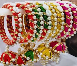 Handcrafted Multicolor Pearl Latkan Bangles Set in Size 2.6 featuring vibrant red green yellow and pink silk thread - Product Image 1