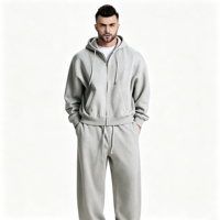 Ensemble de survêtement décontracté haut de gamme gris clair moderne, respirant, avec sweat à capuche zippé et pantalon large à cordon de serrage, deux pièces
