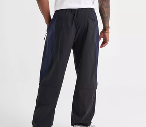 Pantalon de survêtement blanc surdimensionné pour homme, coupe large, avec empiècements latéraux contrastants noirs et détails de passepoil, taille à cordon de serrage, 100% coton, vente en gros sur mesure - Product Image 3