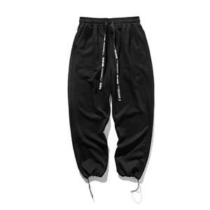 Pantalon de survêtement en coton noir pour homme, taille élastique avec cordon de serrage, décontracté, avec poches latérales, pour l'automne - Product Image 1