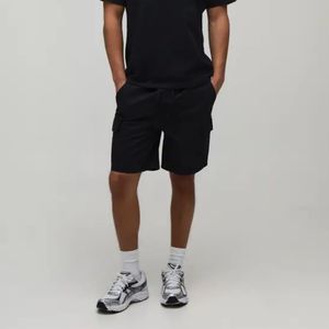 Shorts cargo unisexes en coton noir uni pour homme, taille élastique, décontractés, respirants, avec poches, taille mi-haute - Product Image 1