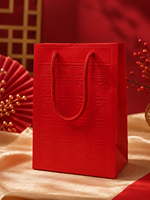 Sac cadeau en papier d'art rouge personnalisé de style chinois avec motif en relief et poignée en corde tressée pour mariage, festival, emballage de thé