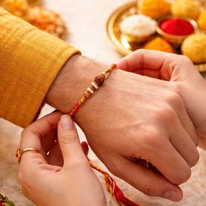 Elegant Rudraksha and Gold-<b>Beaded</b> Designer Rakhi Exquisite Handcrafted Sacred <b>Thread</b> for Brothers Indian Craftsmanship - Product Image 1