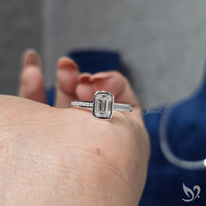 Sleek emerald cut 1ct lab grown diamond ring with bezel <b>frame</b> and channel band in 10k white gold - Product Image 5