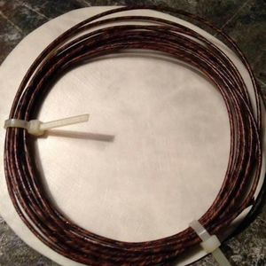image is of a hank of braided <b>cord</b>, likely made from natural materials such as <b>leather</b> or gut - Product Image 1