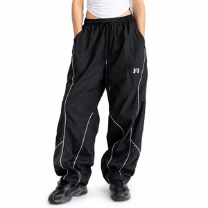 Pantalones de hombre a la moda, de alta calidad, con ribetes personalizados, logotipo bordado, holgados, impermeables, cortavientos, de poliéster, estilo baggy, de nailon, para deporte. - Product Image 1