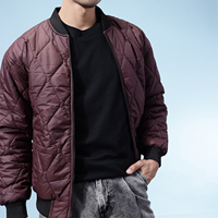 Blouson matelassé noir pour homme, coupe-vent, fermeture éclair, couleur unie, rembourrage polyester, style bomber varsity, idéal pour l'automne