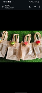 Handcrafted Eco-Friendly Jute Favor Bags with Transparent <b>Windows</b> and Floral Accents Exquisite Handcrafted Jute Favor Bags - Product Image 3