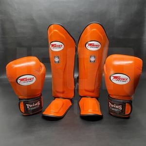 Guantes de Kickboxing y Sanda Twins Naranja al por Mayor, Set de Protectores de Tibia de Cuero Genuino de Vaca, Equipo Ligero de Boxeo y Artes Marciales - Product Image 1
