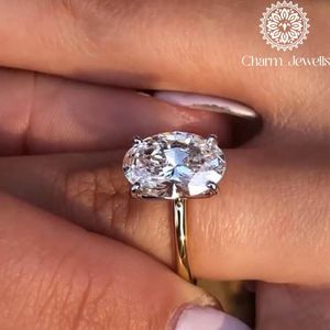 Bague de fiançailles et d'éternité classique Charm_Jewells pour femme, en argent plaqué or rose 18 carats, avec moissanite taille coussin et sertissage à griffes - Product Image 1