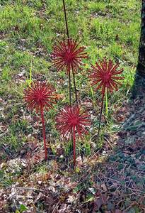 Red Metal Starburst Garden Stakes Outdoor Decor Modern Style Plastic Coated for Yard and Patio - Product Image 1