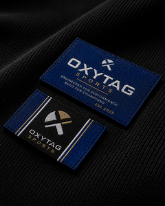 ป้ายผ้าปักลาย Oxytag Sports รูปทรงสี่เหลี่ยมผืนผ้า สำหรับติดเสื้อผ้า ตัดขอบด้วยเลเซอร์ ราคาขายส่ง รับผลิตตามแบบ OEM ป้ายปี 2026 - Product Image 1