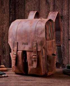 กระเป๋าเป้สะพายหลังกันน้ำสำหรับเดินทาง หนังแท้คุณภาพสูง สไตล์วินเทจ ป้องกันการโจรกรรม ความจุ 20-35 ลิตร เหมาะสำหรับทุกเพศ - Product Image 1