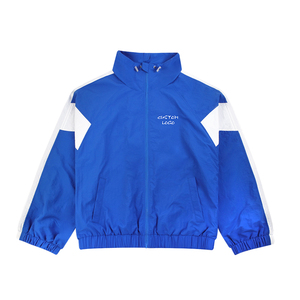 Veste de course coupe-vent bleue pour homme avec empiècements blancs et logo brodé, fermeture éclair frontale, style sportif, idéale pour le printemps - Product Image 1