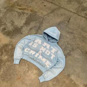 Light Blue Cropped Hoodie. Oversized <b>Bleached</b> Effect Graphic Hoodie. Distressed Raw Hem Streetwear Crop Jacket. OEM Manufacturer - Product Image 2