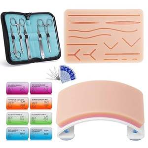Kit de Práctica de Sutura Manual Reutilizable de 33 Piezas para Estudiantes de Medicina con Almohadillas de Silicona Pre-cortadas y Curvadas, Herramientas Quirúrgicas e Hilos - Product Image 1
