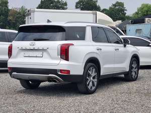 รถ SUV มือสองสีขาว ปี 2022 รุ่น Palisade เครื่องยนต์ดีเซลเทอร์โบ เกียร์อัตโนมัติ ฝากระโปรงท้ายไฟฟ้า เบาะไฟฟ้า รถมือสองจากเกาหลี ไฟ LED ระบบ LDWS ระบบ AEB - Product Image 2