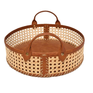 Small <b>rectangular</b> woven <b>basket</b> shown with its lid propped open on a table alongside festive ritual items available at wholesale. - Product Image 4