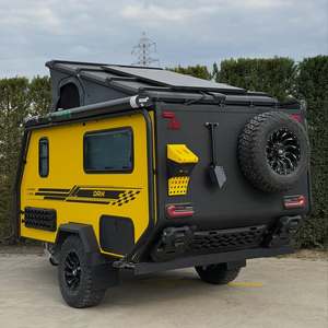 Caravane compacte tout-terrain avec cuisine moderne, espace de couchage et salle à manger pour 4 personnes, idéale pour le camping aventure. - Product Image 1