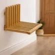 Wall mounted folding <b>chair</b> with a wooden seat in a natural wood finish for indoor use. - Product Image 6