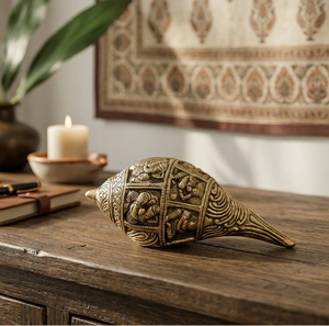 Ornate vintage brass shankh with detailed traditional relief carvings, perfect for decor, available at wholesale prices. - Product Image 1