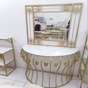 <b>Wall</b>-mounted console <b>table</b> with dark wooden top and an ornate gold scrollwork leg base, available at wholesale prices. - Product Image 2