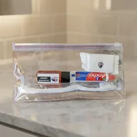 Mini kit de voyage avec shampoing, dentifrice, brosse à dents, savon dans un sac en plastique transparent, ensemble d'accessoires d'hôtel