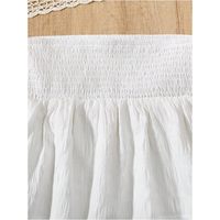 Jupe courte élastiquée blanche pour femme, coupe trapèze, volants, design asymétrique, boutons décoratifs, style luxueux uni, toutes saisons