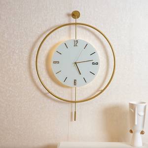 Elegant White Dial <b>Wall</b> <b>Clock</b> with Gold Metal Frame and Hanging Pendulum Accent for Sophisticated Home Interior - Product Image 1