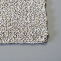 Tapis moderne abstrait en laine feutrée de style corde beige crème, tissé à la main par HARI ENTERPRISES |   Écologique, antibactérien, adapté aux animaux de compagnie