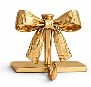 Hammered Design Golden Finish Bow <b>Tie</b> Shape Stocking Holder For Fire Place Home Decoration Use Metal Stocking Holder Hook - Product Image 1