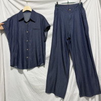 Ensemble deux pièces en jean pour femme : veste courte à manches longues boutonnée et pantalon large en jean, style streetwear tendance
