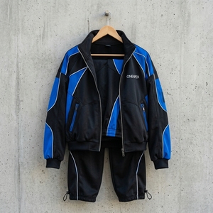 Ensemble de survêtement personnalisé pour homme, noir et bleu, avec veste zippée color block et pantalon de jogging, style athlétique streetwear, vente en gros OEM, vêtements de sport - Product Image 4