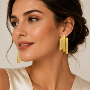 Boucles d'oreilles pendantes ovales texturées en laiton faites à la main Sstringz avec placage or GPC, finition sablée, design tendance et luxueux - Product Image 1