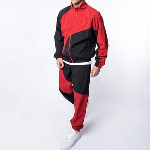 Venta al por mayor personalizado de los hombres de 2 piezas Jogger conjunto impermeable de secado rápido de poliéster bloque de color de nylon cortavientos chándal deportivo de invierno - Product Image 1