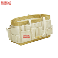 Sac à outils en toile à poches multiples avec renfort en cuir idéal pour les professionnels et les projets de bricolage.