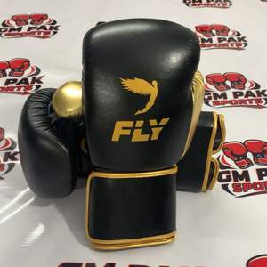 Gants de boxe professionnels - Gants d'entraînement et de sparring en cuir de qualité supérieure - Mittons de frappe Muay Thai or et noir - Product Image 1
