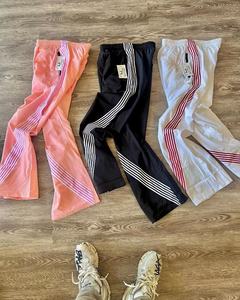 Pantalon de survêtement coupe-vent léger pour hommes avec taille élastique Logo personnalisé Bandes latérales en nylon et doublure en maille - Product Image 4