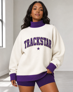 เสื้อสเวตเชิ้ตคอเต่า Trackstar Ivory แต่งลายจุดสีม่วง พร้อมตัวอักษร Varsity ลายจุด ดาว และโลโก้แบบกำหนดเอง แบรนด์ส่วนตัว - Product Image 1
