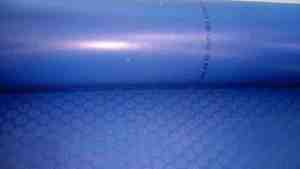 Blue <b>rubber</b> <b>sheet</b> roll partially unrolled isolated on white background for industrial flooring insulation protection - Product Image 5