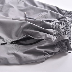 Nouveau pantalon de ski imperméable gris léger au design baggy avec bouches d'aération à taille élastique et poches zippées sécurisées - Product Image 5