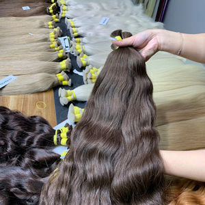 ราคาโรงงาน ผมต่อแท้สีน้ำตาลธรรมชาติแบบลอน 30 นิ้ว เกรดซุปเปอร์ดับเบิ้ลดรอน เนื้อผมนุ่มลื่น ไม่หลุดร่วง - Product Image 1