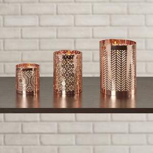 Portavelas metálico premium que agrega un encanto refinado, una luminosidad subtil y una elegancia artística a los interiores de viviendas. - Product Image 1