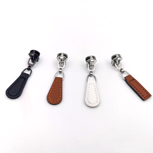 Nouvelle Arrivée OEM 2026 – Tête de Fermeture Éclair en Cuir Personnalisée en Gros pour Sac, Fabriquée par TRIOTAKE INDUSTRY - Product Image 1